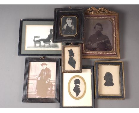 Three 19th century cut paper silhouettes of gentlemen, a 19th century tin type portrait of an unknown woman, a&nbsp; printed 