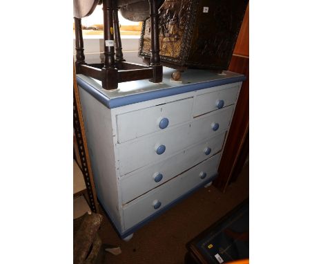 A dark and light blue painted chest of two short and three long drawers, on bun feet, 40" wide x 18" deep x 43" high 