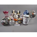 Four Chinese millefiori ginger jars, a blue and white prunus decorated ginger jar, a silver collared