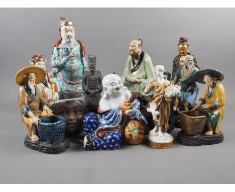 A Chinese figure of a seated Buddha, seal mark to base, a figure of an emperor and various other Chinese and Japanese figures