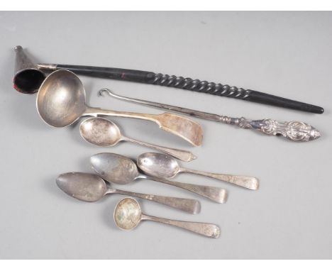 A silver and turned ebony candle snuffer, a silver ladle, five various silver spoons and a button hook, 4.6oz troy weighable 