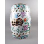 A Chinese porcelain garden seat with polychrome bird, fruit and flower decoration, 18 1/2" high