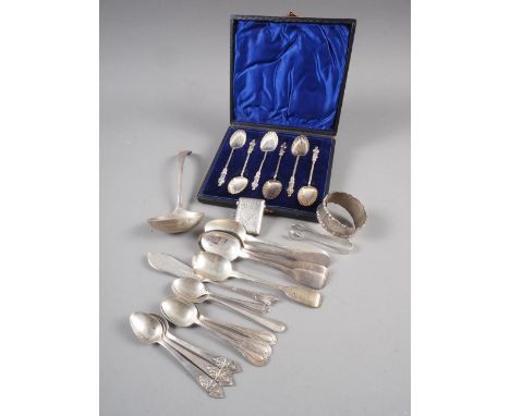 A set of six silver apostle spoons, in fitted case, a ladle, a vesta case, a napkin ring, a pair of sugar tongs, a butter kni