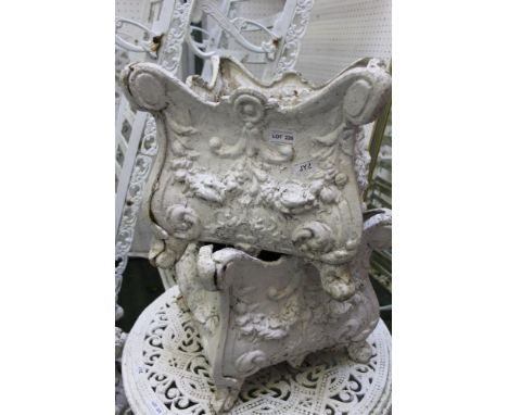 A pair of white painted cast metal garden planters 