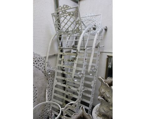 A pair of white painted metal garden adjustable loungers 