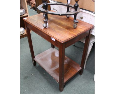 A first quarter 20th century oak finished two-tiered table 
