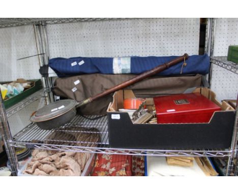 A shelf containing a selection of useful indoor and outdoor domestic items 