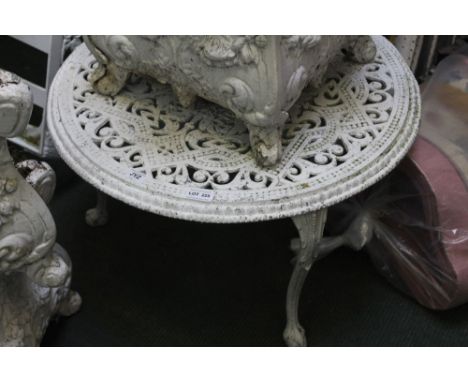 A white painted cast metal low circular garden table 