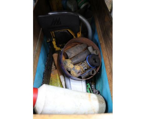A box containing a chainsaw and all manner of varying tools to go with 
