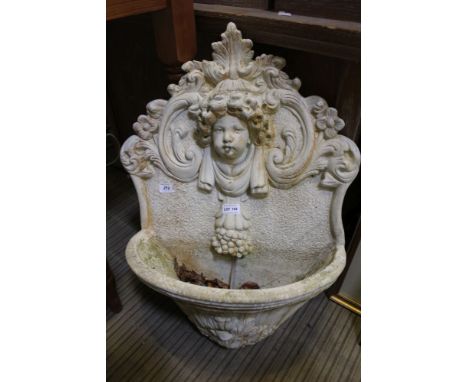 A cast concrete decorative hanging garden water feature 