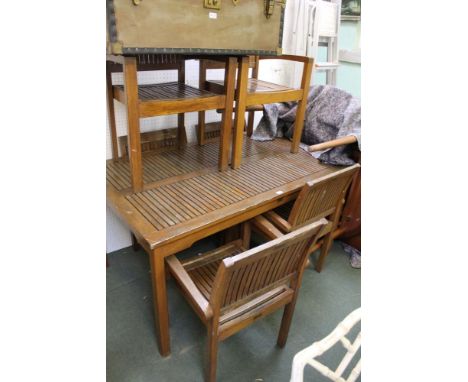 A teak slat built garden suite, comprising rectangular topped table and six slatted armchairs, originating from Notcutts 