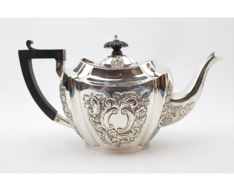 Late Victorian Silver Oval boat shaped Teapot with embossed foliate decoration by John Millward Banks, Birmingham 1897, 290g 