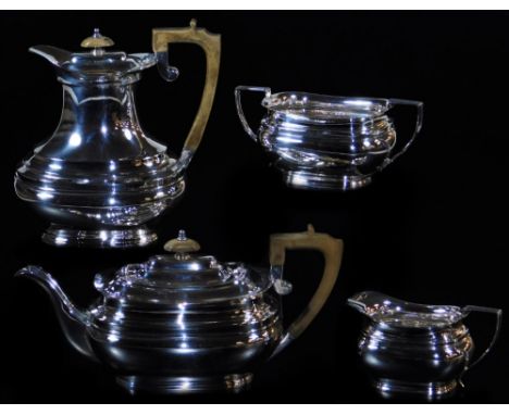 An Elizabeth II silver four piece service, comprising coffee pot 21cm high, teapot, milk jug and two handled sugar bowl, each