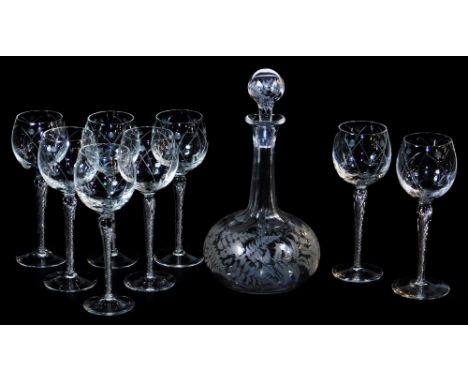 A 20thC drinks set, comprising decanter, 29cm high, and eight hock glasses, each with a repeat geometric floral pattern and d