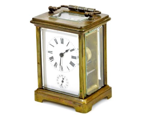An early 20thC brass carriage clock, of rectangular form with 6cm back plate, set with a Roman numeric dial and subsidiary Ar
