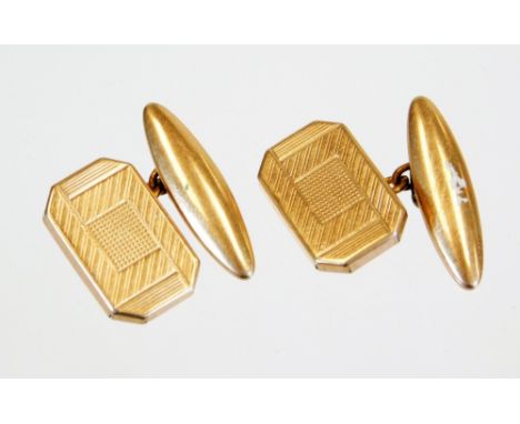 A pair of engine turned cufflinks, with club backs and chain centres, 2cm wide, unmarked. 