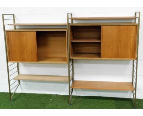 A 1960's teak and metal framed Ladderax open cabinet, with various shelves, open sections and metal stiles with horizontal cy