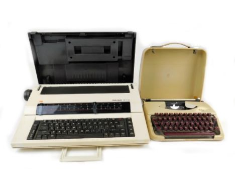 A 20thC Olympia Splendid 33 typewriter, in cream with burgundy keys, in fitted case, marked made in Western Germany, a Gabrie