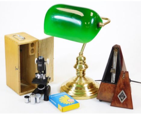 A club style desk lamp, with green shade on turned brass stem and circular foot, 36cm high, a German Maelzel metronome of sha