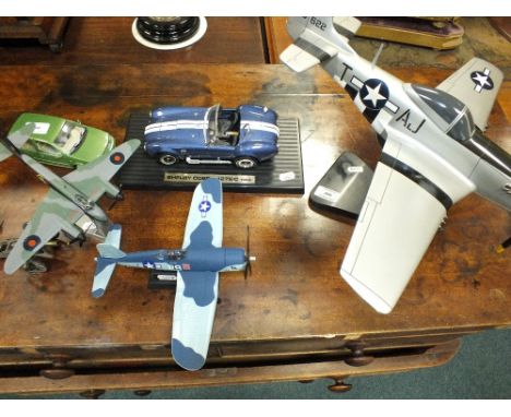 A group of scale models of aviation and automobile interest including a Shelby Cobra 427S/C 1964 on stand, an American 'Birdc