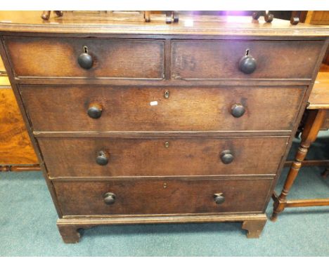 A 19th century oak chest of two short over three long drawers raised on bracket feet.