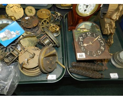 A collection of mantle and desk clock movements in various states of repair together with an Edwardian mahogany balloon clock