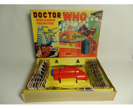 A boxed Dr Who "Give a show projector" by Chad Valley, cat ref: G344R featuring William Hartnell and with 16 strips, 7 frames