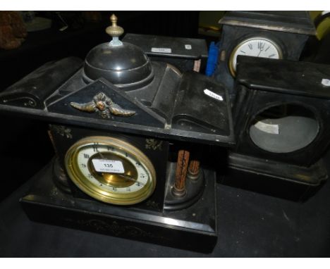 Three late 19th to early 20th century slate or black marble mantle clocks together with an early 20th century slate mantle cl