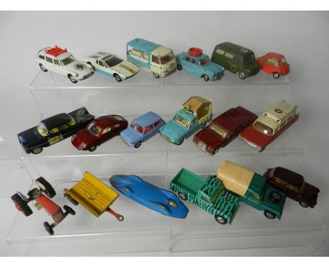 Eighteen unboxed Corgi toys dating from the 1960s in various conditions to include A60 driving school car, Bedford and Cadill