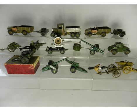 A group of Britains army equipment items to include a 3 axle lorry and 2 Beetle lorries, several limbers and cannons, Lone St