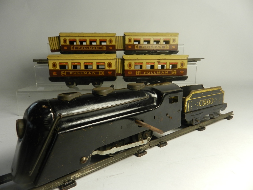 An Art Deco clockwork train set circa 1940s by Marx, the loco of