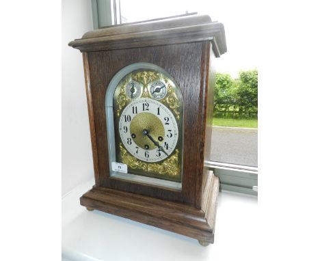 A German Junghans bracket clock, in an oak ogee case