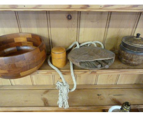 A turned oak tea caddy, cow bell, turned wooden bowl and a Treen pot