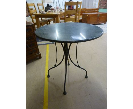 A Cast iron coffee table with marble top