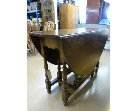 An oak drop leaf table 