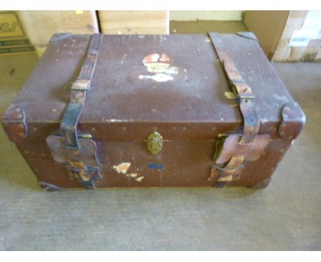 A Large steamer trunk marked GCP 'Harrods' - torn sticker to front ' Cunard White Star Line possibly Aquitania.