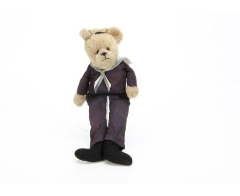 A British unjointed sailor teddy bear 1940s,  with beige mohair head and hands, orange and black glass eyes, black stitched n