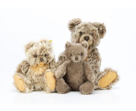 Two Steiff Zotty teddy bears,  the largest --13½in. (34.5cm.) high and smaller with button (faded); and 1960s mask faced tedd