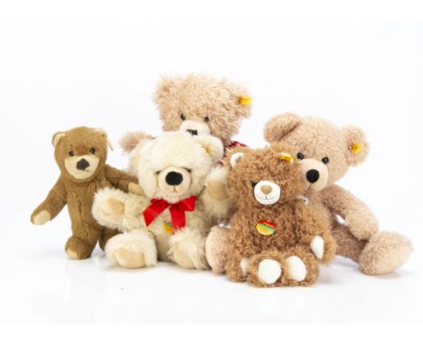 Five unjointed yellow tagged Steiff teddy  bears,  Fynn --14in. (36cm.) high; a 2007 bear in jumper and two Cosy Friends (exc