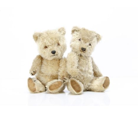 Two post-war Chiltern Hugmee teddy bears, one with blonde mohair, orange and black glass eyes, black stitched nose, mouth and