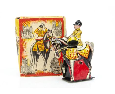 A Wells-Brimtoy clockwork Mechanical Drummer Boy,  lithographed tinplate Household Cavalry drum horse, in original box --5½in