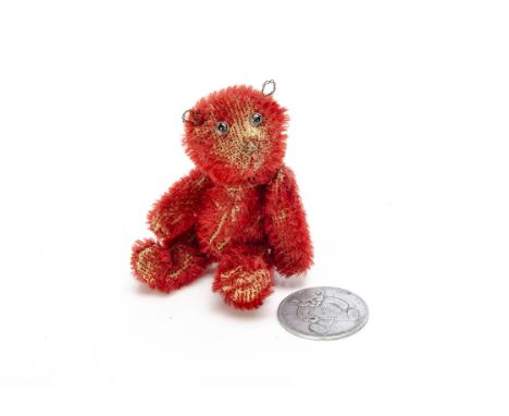 A rare Farnell red mohair soldier teddy bear, with clear and black glass eyes, remains of pipe-cleaner ears, swivel head and 