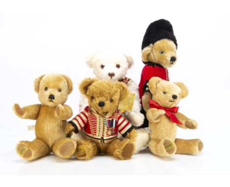 Five Merrythought teddy bears,  a bear for Buckingham Palace with jacket,  medals and card tags  --13½in. (34.5cm.) high; a w