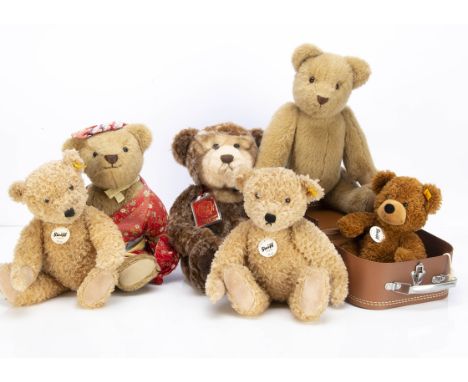 Three soft yellow tagged Steiff teddy bears,  a Hannes in suitcase --10¼in. (26cm.) high; and two Elmars (one with slight dir