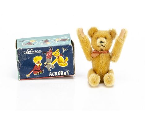 A Schuco clockwork Acrobat teddy bear 1950s,  with golden mohair, clear and black glass eyes with brown backs, pronounced muz