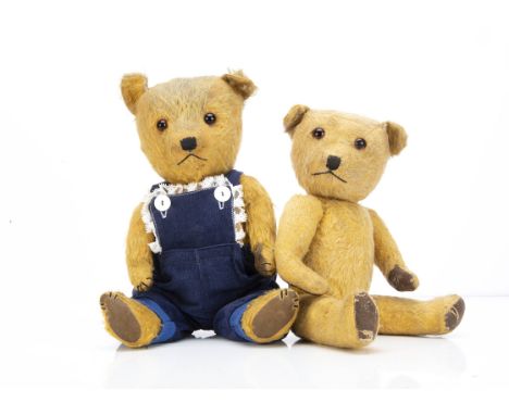Two post-war Chiltern Hugmee teddy bears, with golden mohair, orange and black glass eyes, black stitched nose and mouth, swi