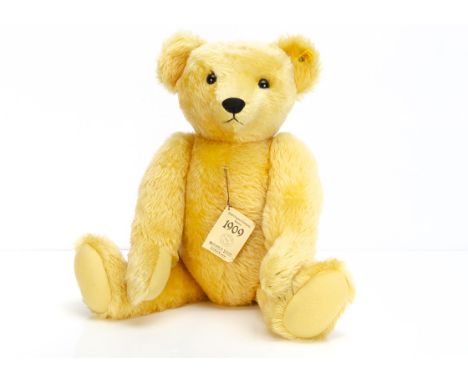 A large Steiff yellow tagged Replica 1909 Teddy Bear,  0165/60 with card tag, 1984-86 --24in. (61cm.) high 