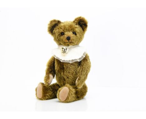 A 1950s Knickerbocker teddy bear,  with brown mohair, orange and black glass eyes, muzzle with black stitched nose and mouth,