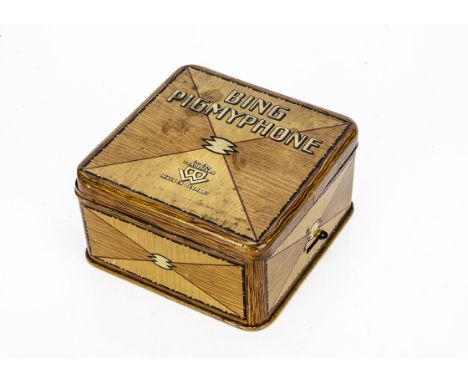 A Bing clockwork tinplate Pigmyphone,   lithographed wood-effect tinplate box with speaker, soundbox and key --5¾in. (14.5cm.