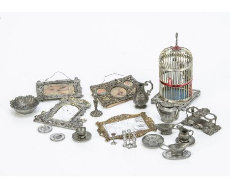 Metal dolls' house chattels,  soft metal - parrot cage --3¾in. (9.5cm.) high, a picture frame, three parts of a piece of soft